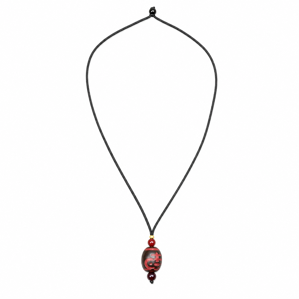 Red Dzi pendant necklace on white background
