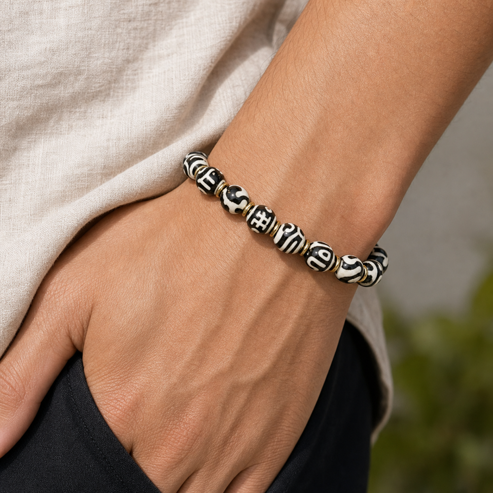 Male model wearing black white Dzi bracelet