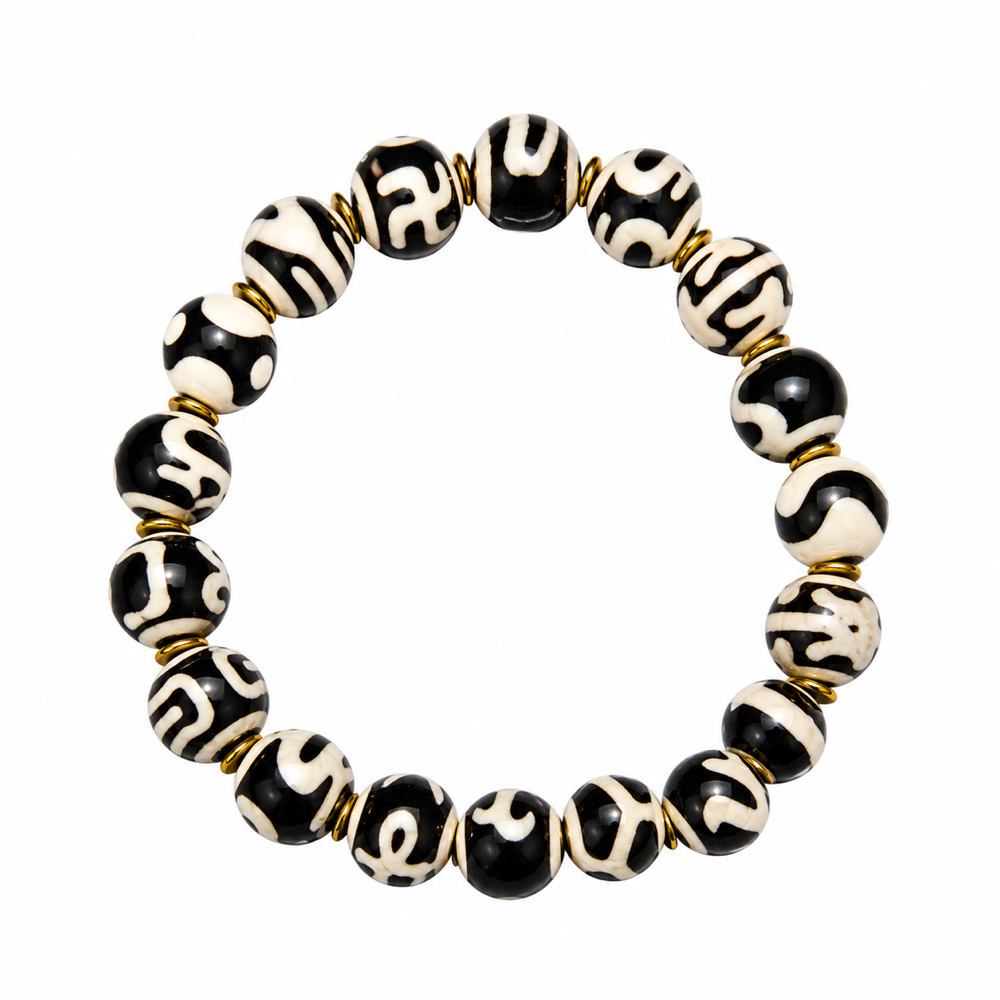 Black white Tibetan Dzi bracelet on white background
