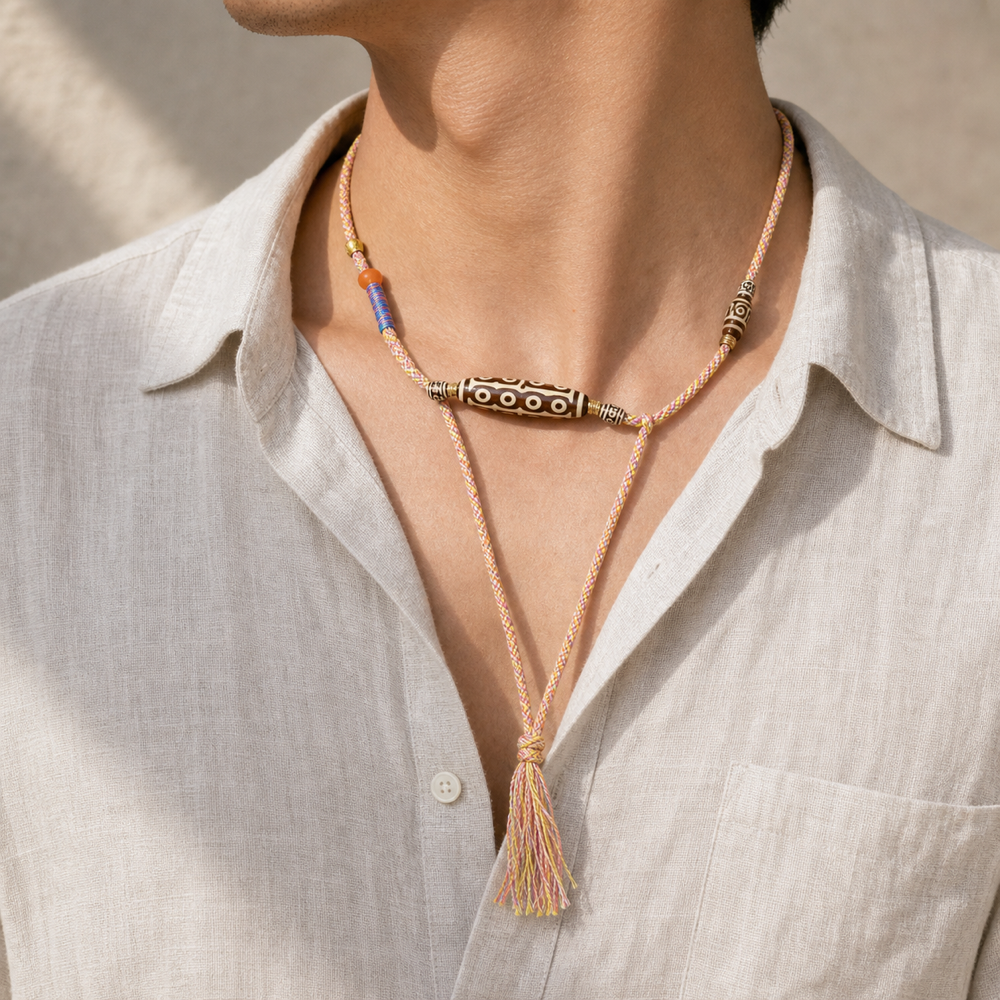 Male model wearing colorful multi-eye Dzi cord necklace