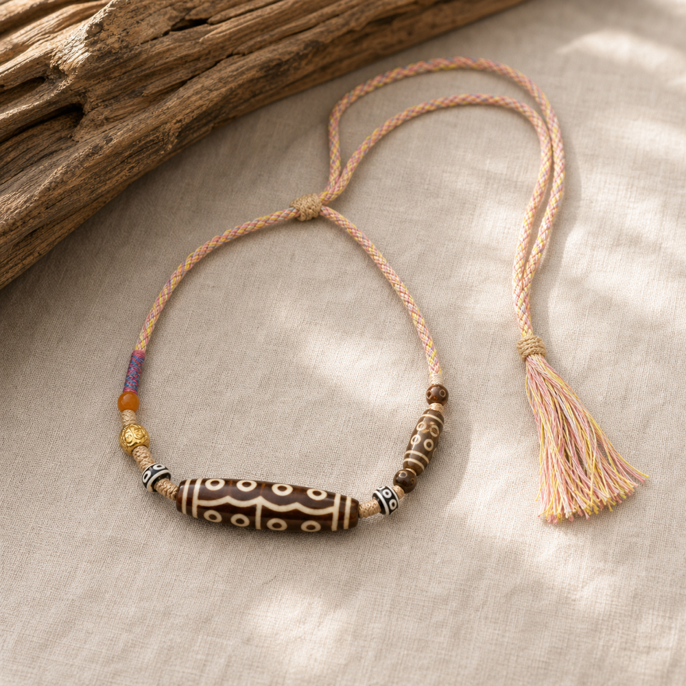 Colorful multi-eye Dzi cord necklace lifestyle scene