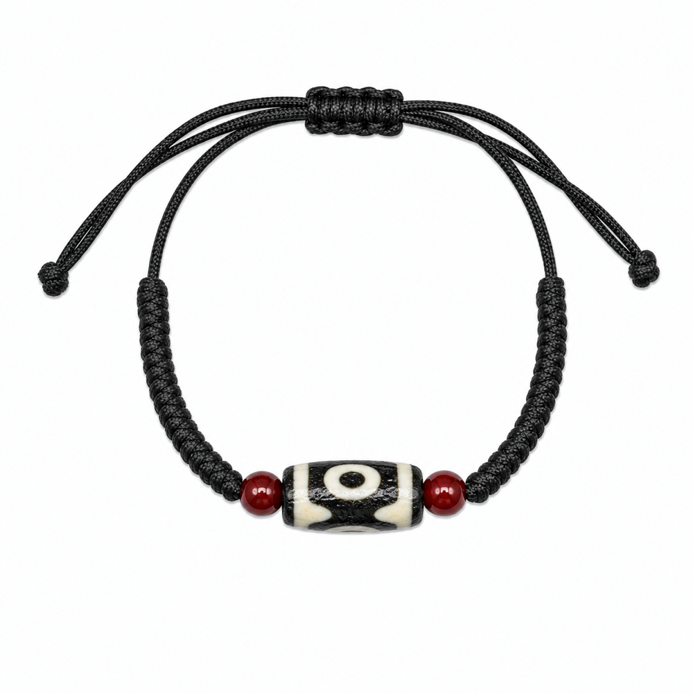 Single-eye Tibetan Dzi cord bracelet on white background