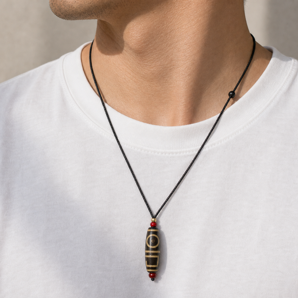 Male model wearing single-eye Dzi pendant
