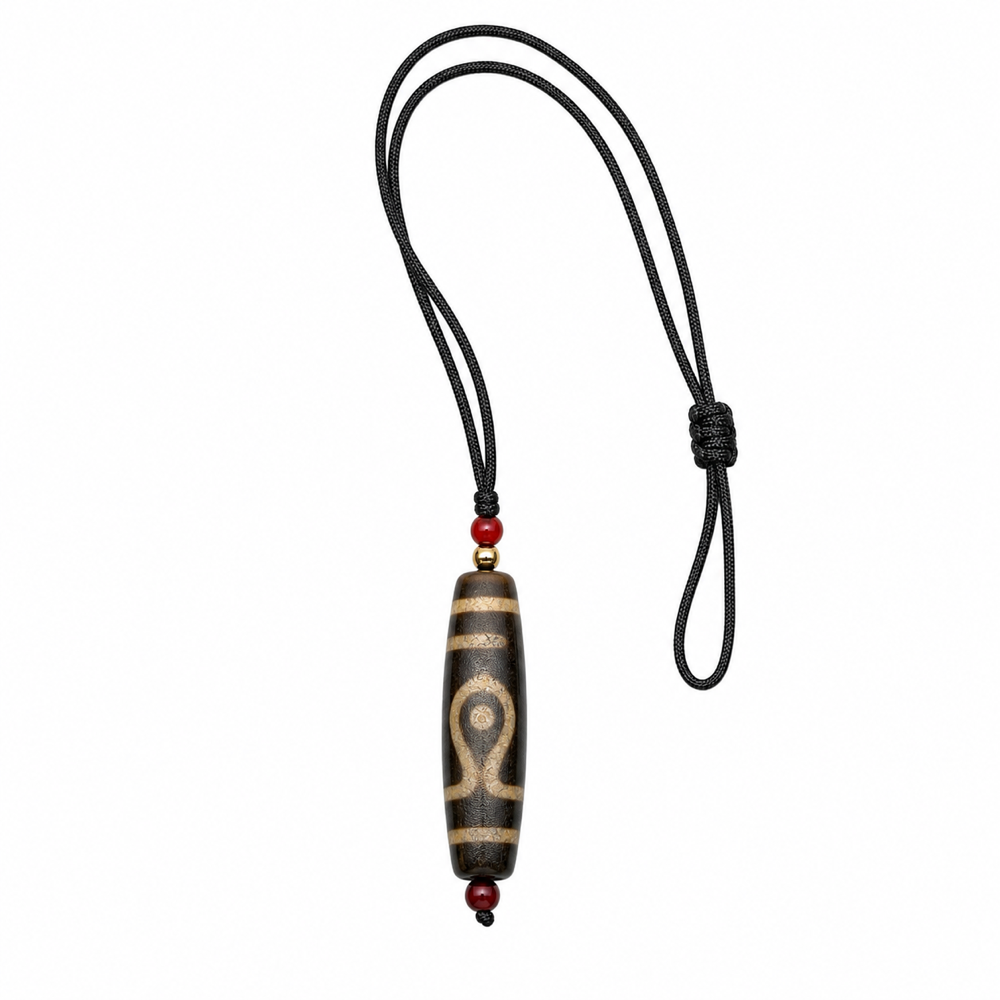 Single-eye Tibetan Dzi pendant on white background