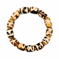 Cream brown Tibetan Dzi bracelet on white background