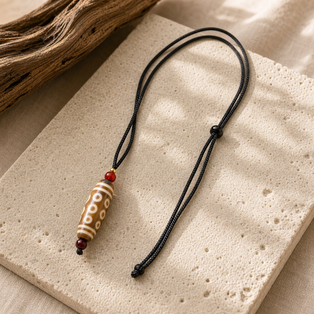 Light brown multi-eye Dzi pendant lifestyle scene