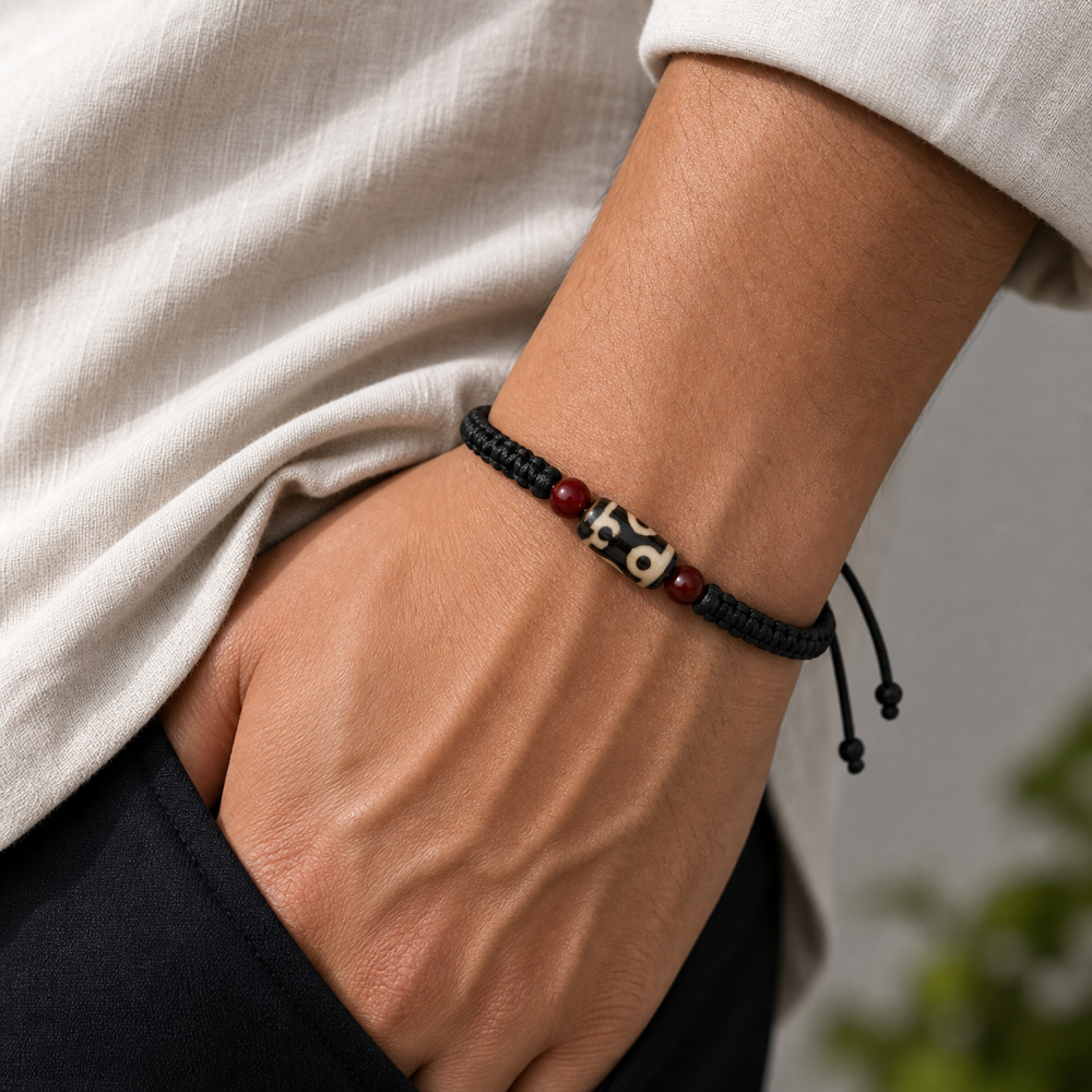 Male model wearing black cord Dzi bracelet
