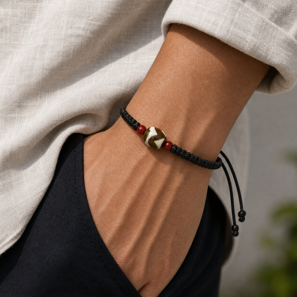 Male model wearing round brown cream Dzi bracelet